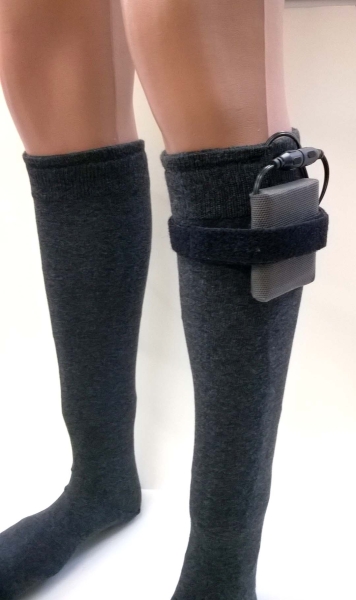 Battery attached to the leg with Velcro holder from Heizteufel
